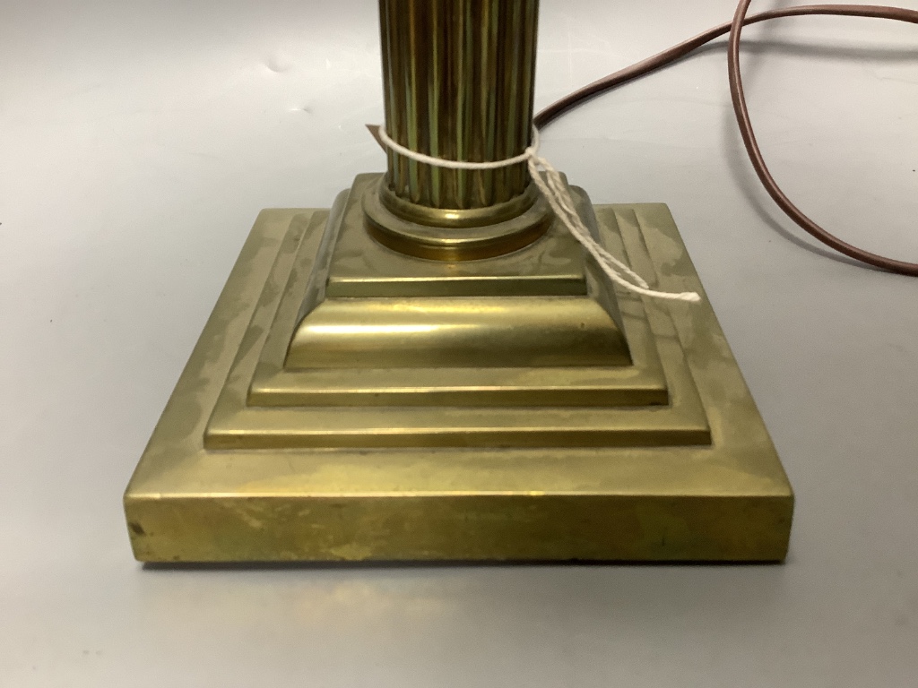 A brass corinthian table lamp and an Edwardian inlaid mahogany letter rack